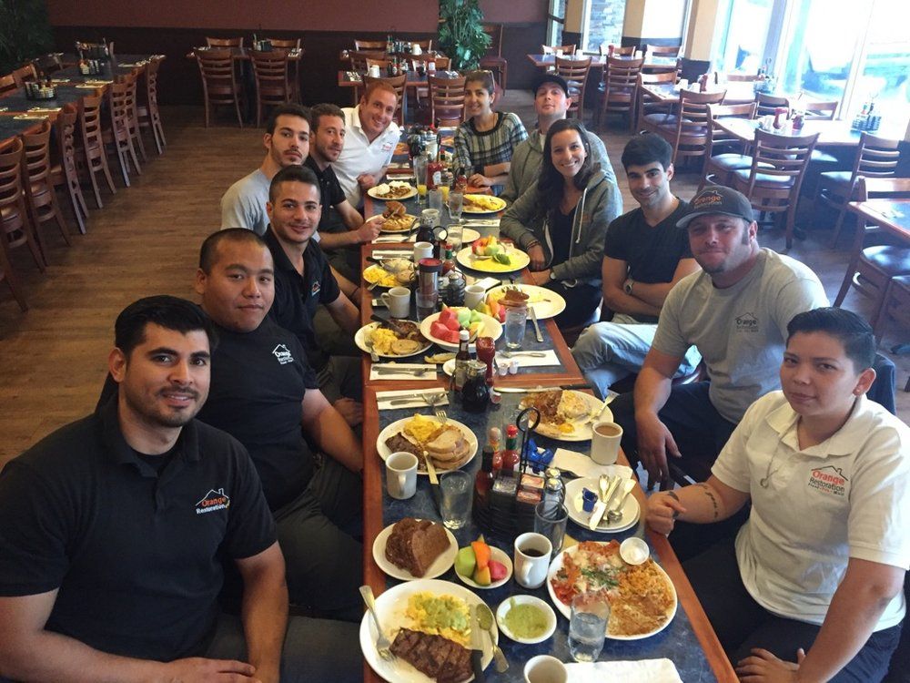 Orange Restoration team at breakfast meeting