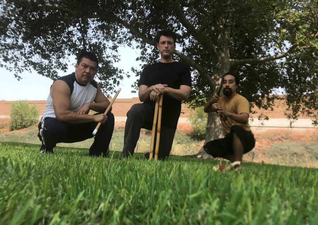 With students Justin and Armando