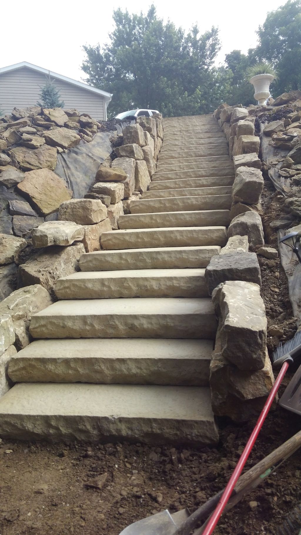 Stone casted steps bordered with barn stone