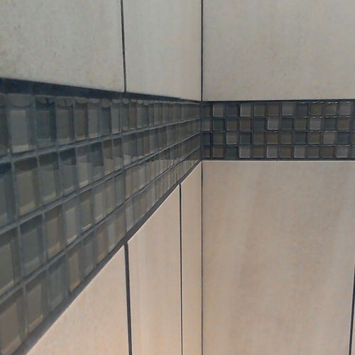Glass tile beltline in a tub surround in Mukilteo