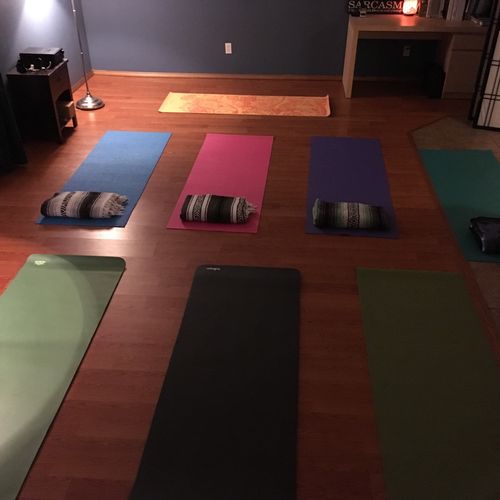 The yoga space set up for an evening group class.