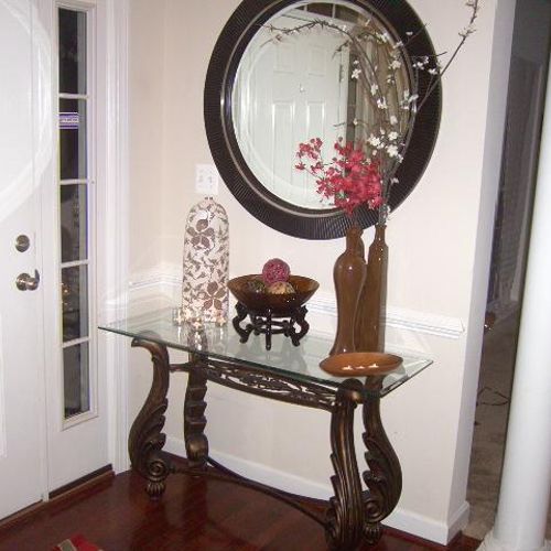 Traditional entry console with dark tones. paired 