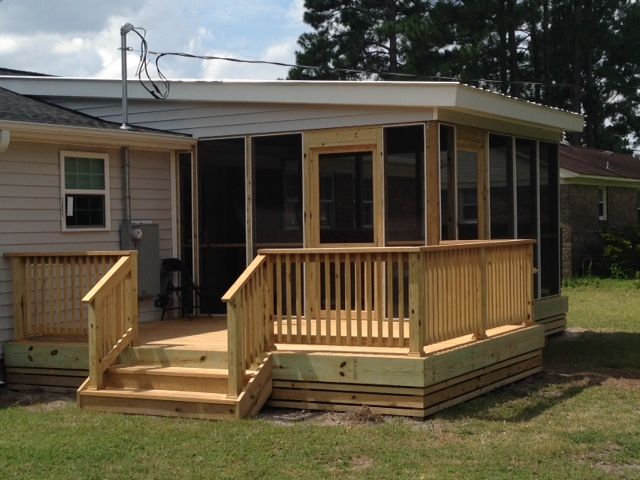 Screened in porch with hot tub and outside eating 