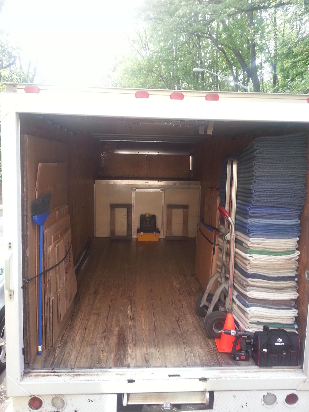 A fully equipped vehicle with pads, dollies and ma