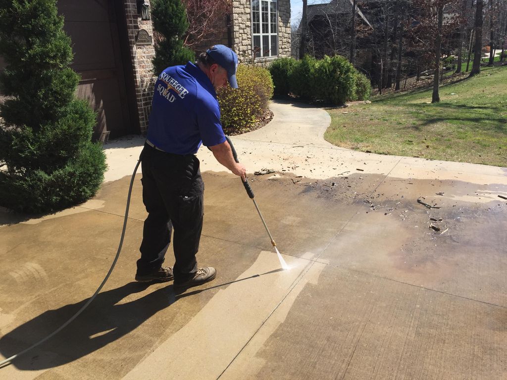 Pressure Washing a driveway.  What a difference!