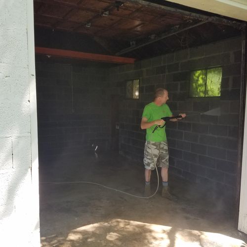 Power washing a garage after emptying it