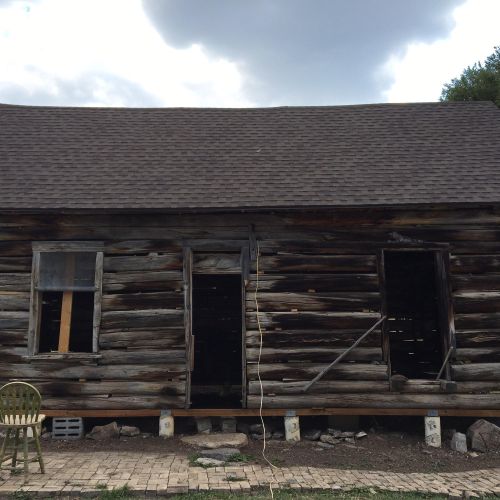 Asphalt shingles. Restoration of pioneer cabin roo