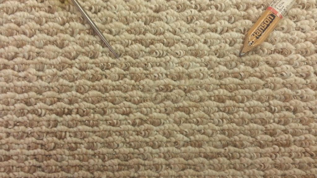 Berber carpet with bonded insert repair (after).