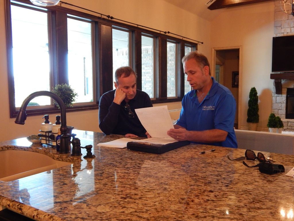 Tim H. reviewing the inspection report with buyer,
