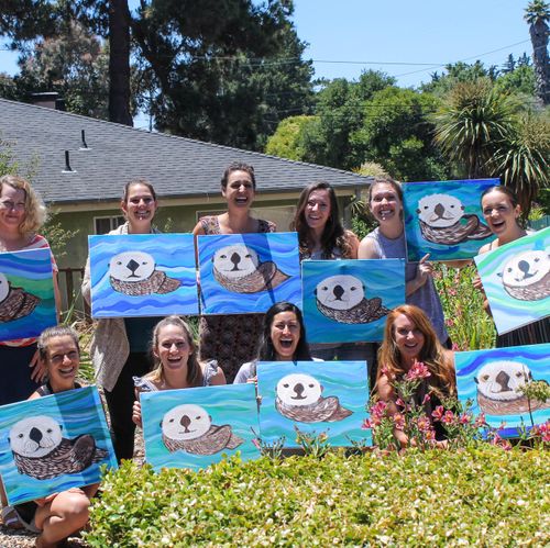 Group class with their completed paintings