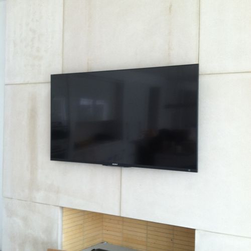 46'' TV above the fireplace.