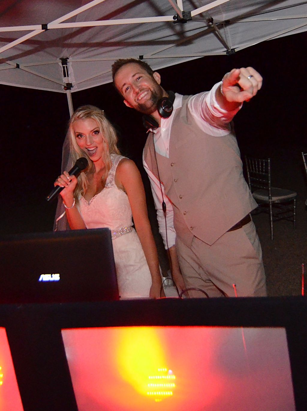 Bride & Groom behind the DJ booth