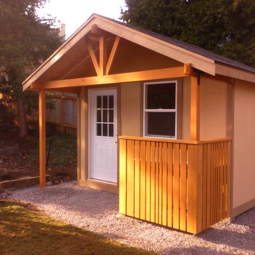 garden/ storage shed with extended roof and workbe