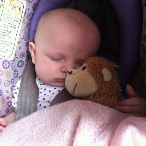 My daughter, Rylee asleep in her carrier with her 