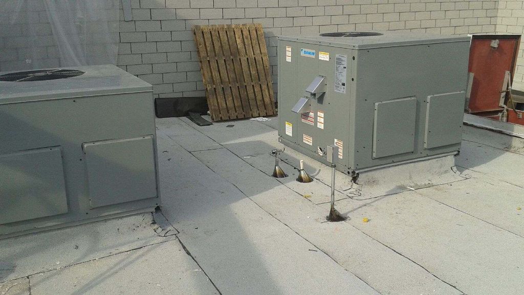 Commercial package units installed on rooftop of c