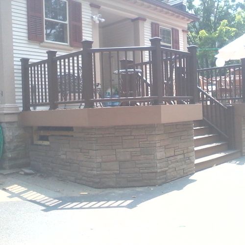 composite deck with cultured stone skirting