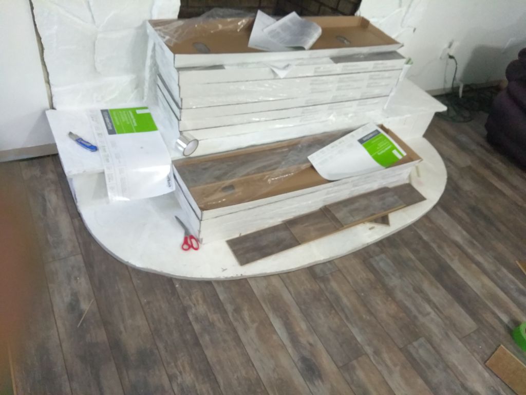 Luxury Vinyl Plank cut around fireplace