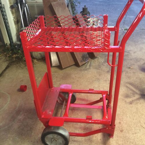 I made this welder cart from a Two wheel hand-truc