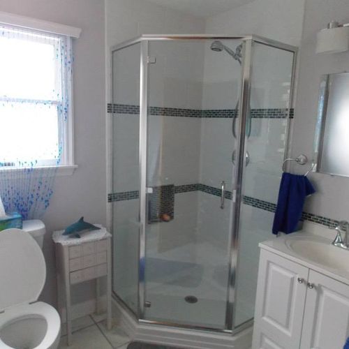 After: By installing a 38" corner shower base with