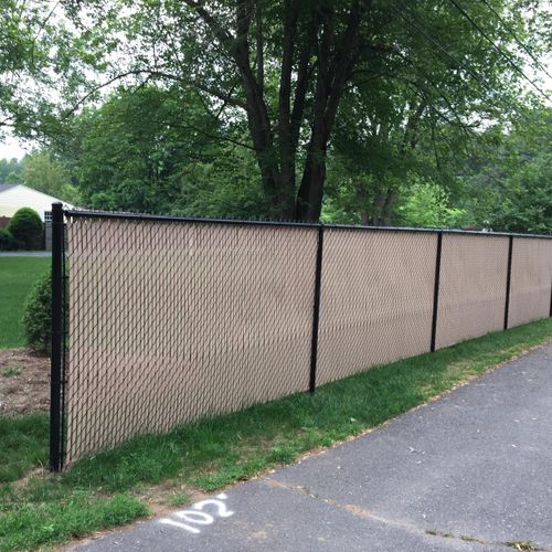 Black Chain Link Fence with Tan Privacy Slats