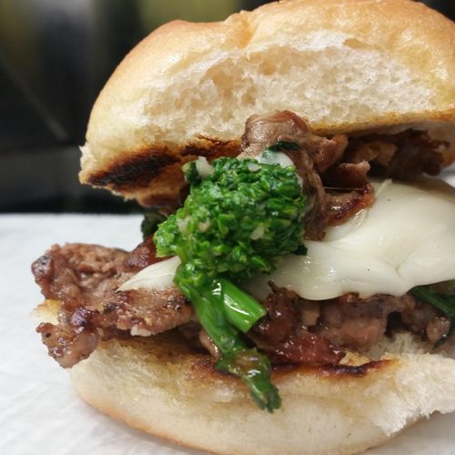 Broccoli Rabe & beef slider with provolone on a bu