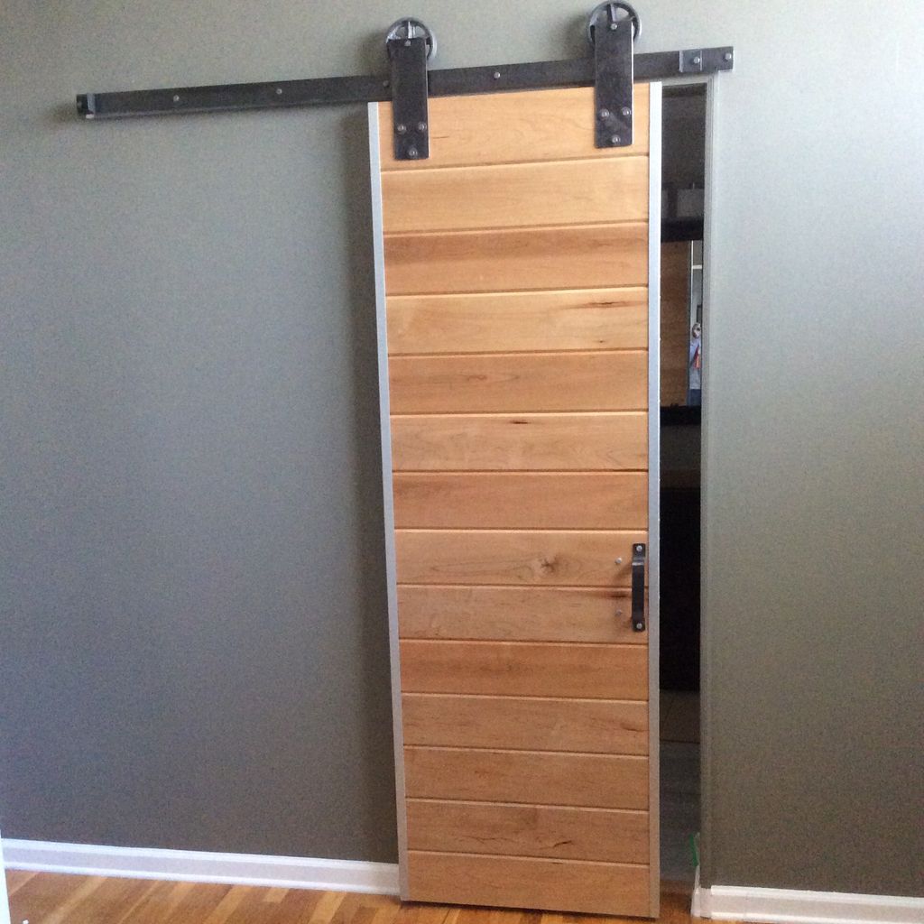 Custom built and installed barn door for master ba