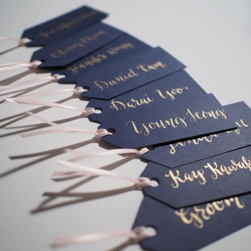calligraphy name tags - gold on blue
