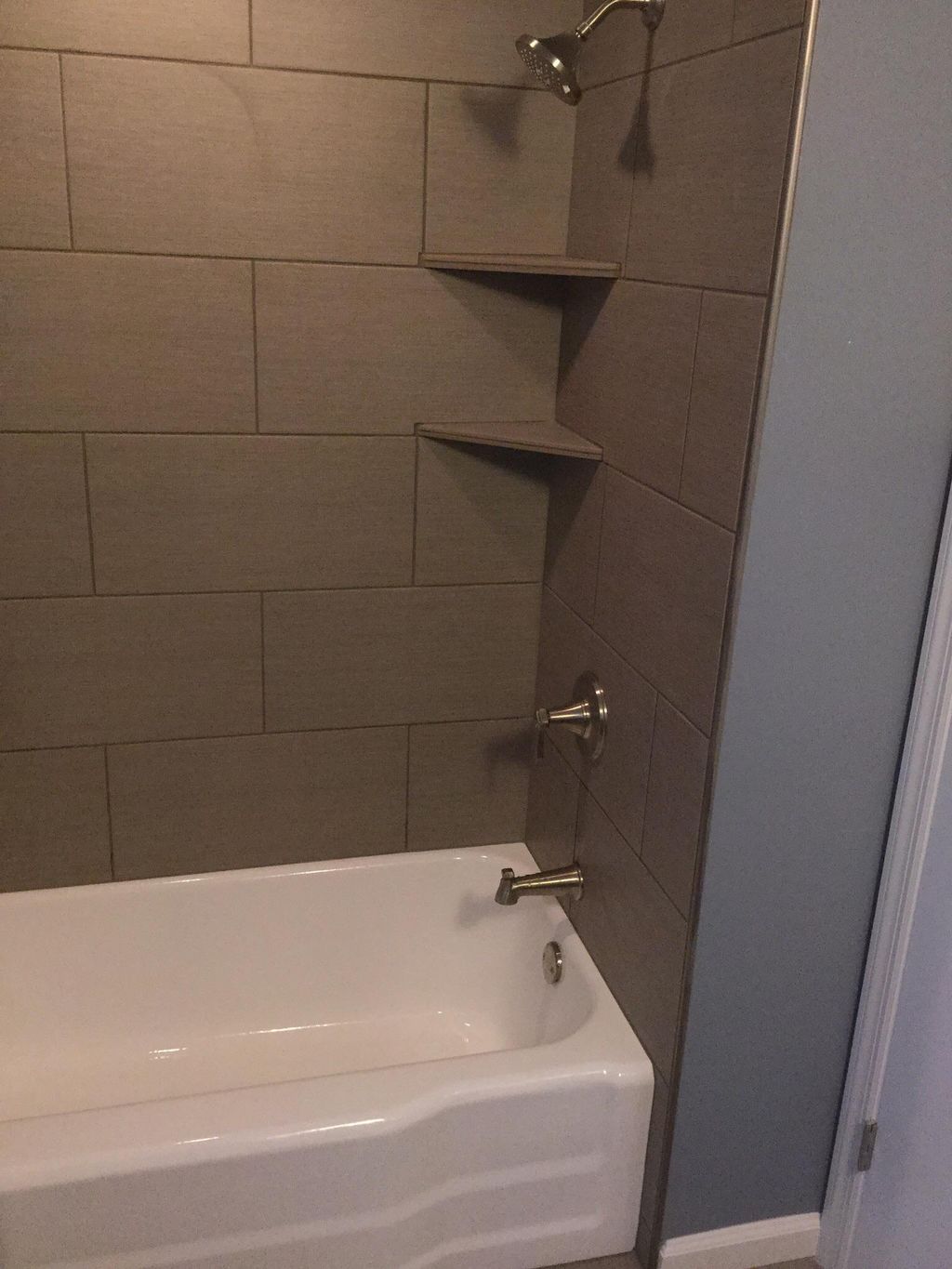 Custom tile tub surround with corner tile shelves