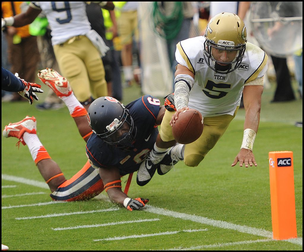 SPORTS ACTION - Georgia Tech quarterback diving fo