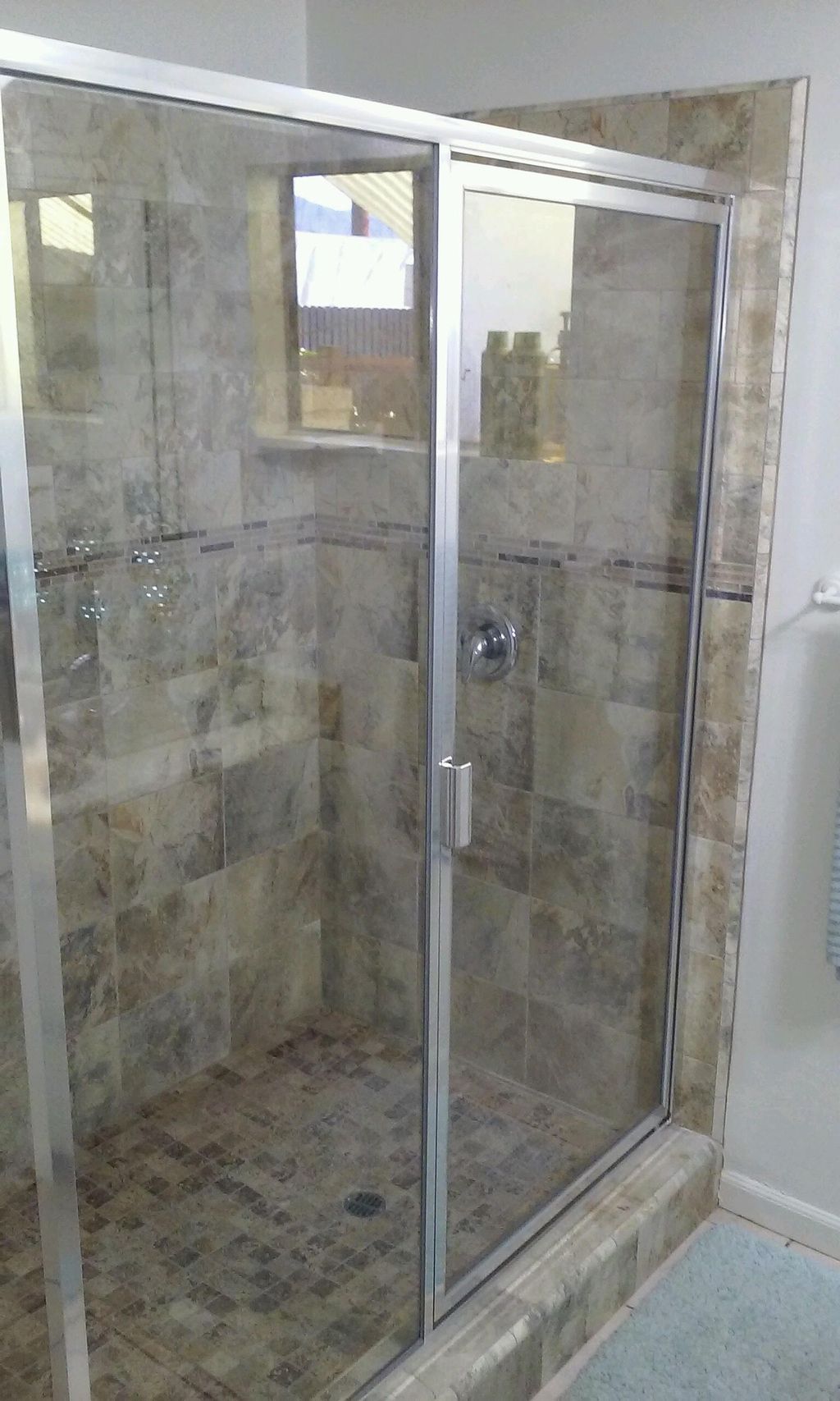 SEMI FRAMELESS SHOWER DOOR INSTALLED 2014. WE ALSO