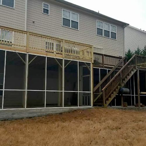 Deck extension with screened in porch below in Sto