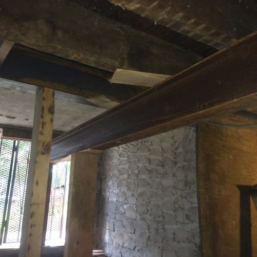 Permanent steel girder supporting floor joists.
11