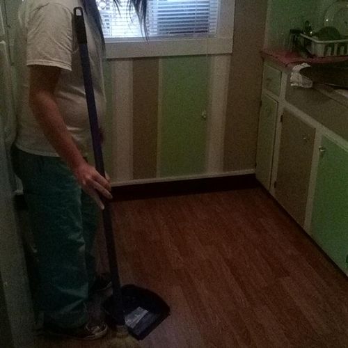 Amanda cleaning a weekly customers house.