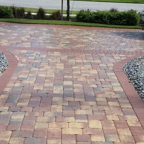 Pressure Washed Pavers then applied Sealer to Make