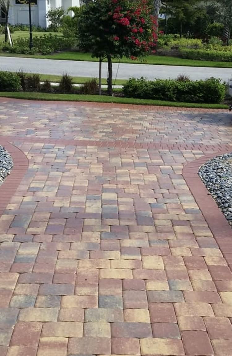 Pressure Washed Pavers then applied Sealer to Make