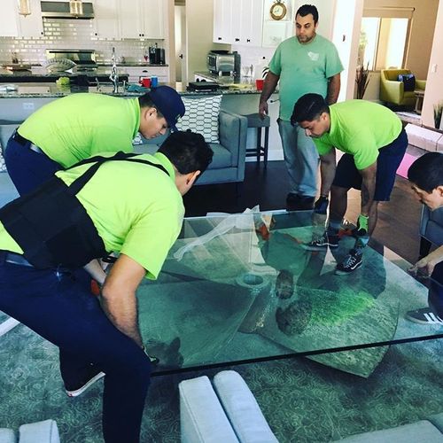 A 500lb coffee table is no problem for these pros!