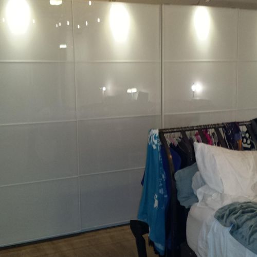 Assembly of IKEA wardrobe with sliding glass panel
