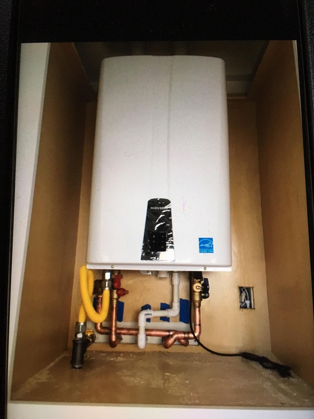 Install in a laundry cabinet of a Navien Tankless 