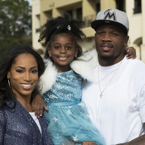 NFL Star Ande Johnson his wife and daughter.