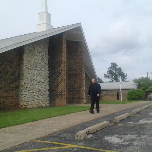 Pastor Walt picture in front of Church as a fill i