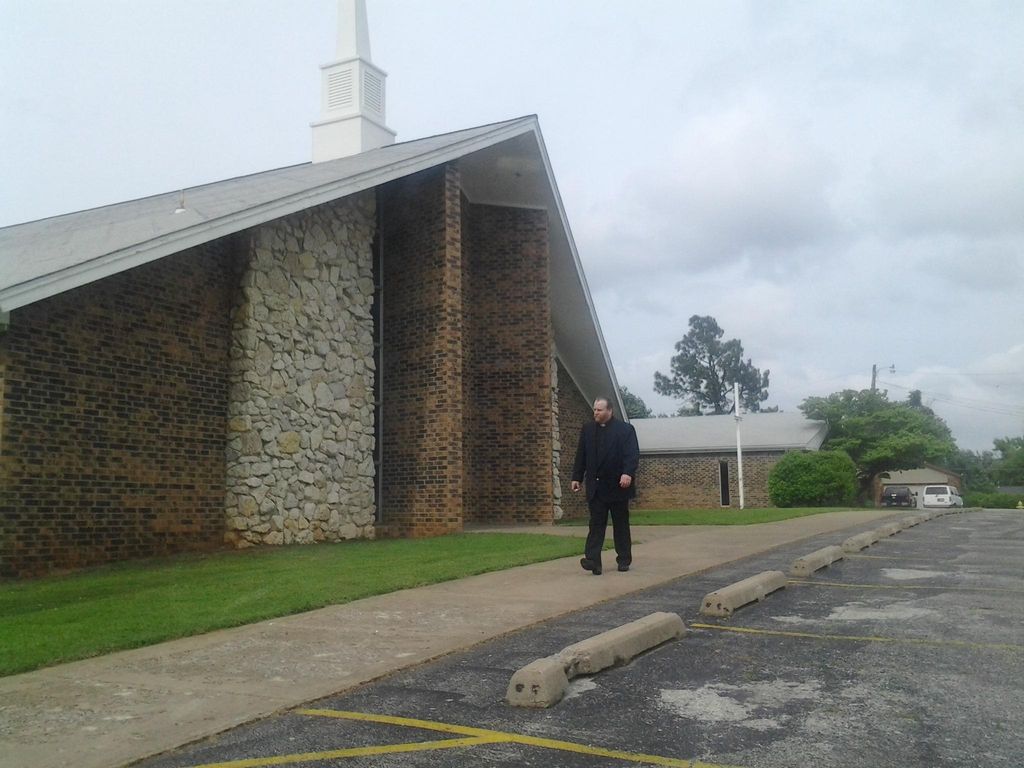 Pastor Walt picture in front of Church as a fill i