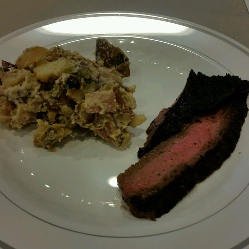 Coffee rubbed flank steak with a smoked potato sal