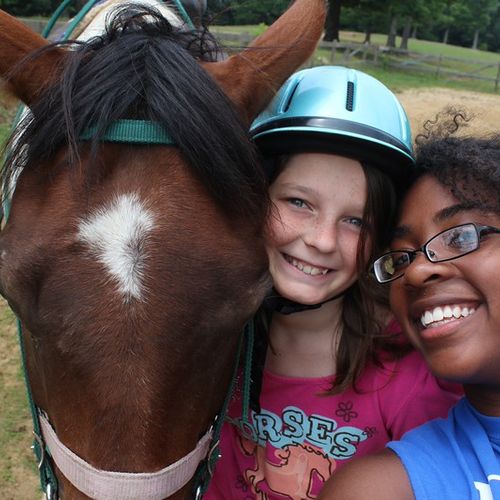 one of my campers and I at the horse barn (while I
