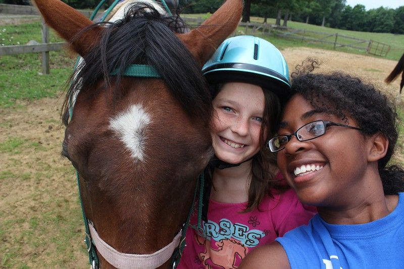 one of my campers and I at the horse barn (while I