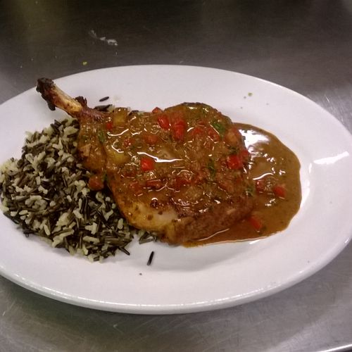 grilled pork chop with a red wine demi glace