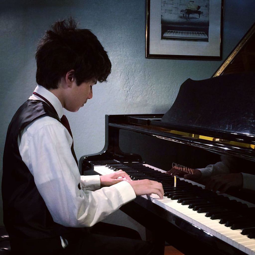 Piano student playing at a recital