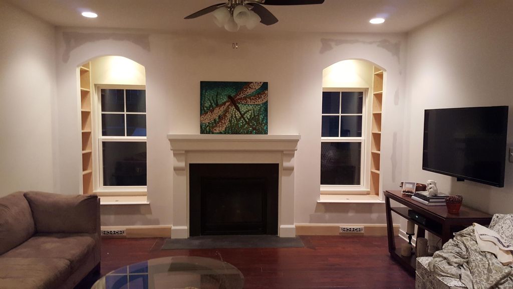 Add shelving and seat on either side of the firepl
