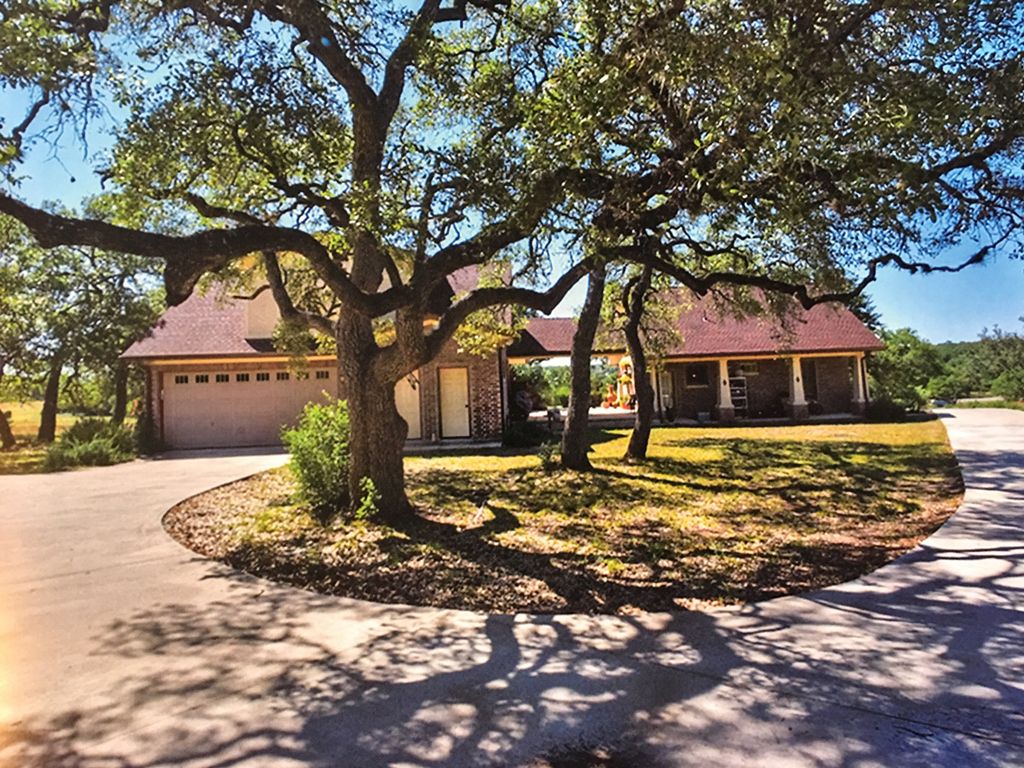 Rear view of House w/Guest House and covered patio