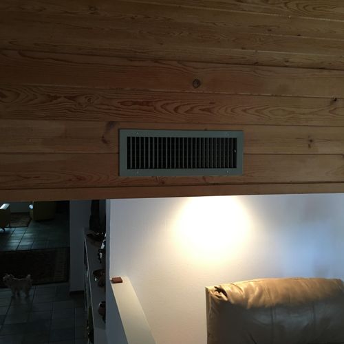Added wood accents around the vents on drop ceilin