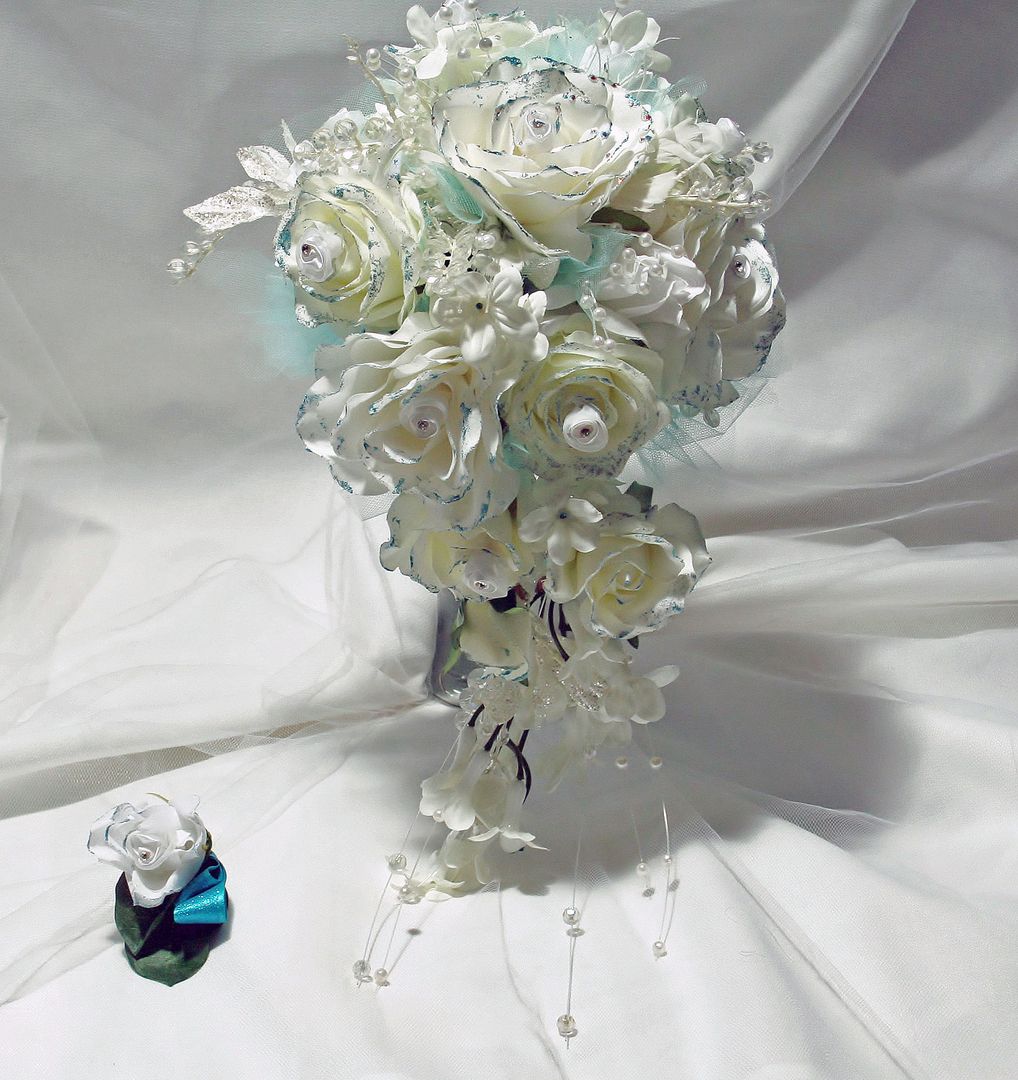 Silk wedding bouquet and groom's boutonniere